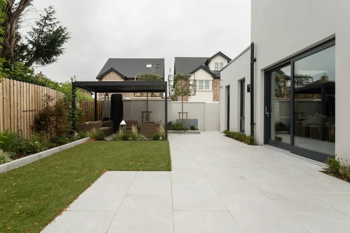 A family house with a garden and a covered patio